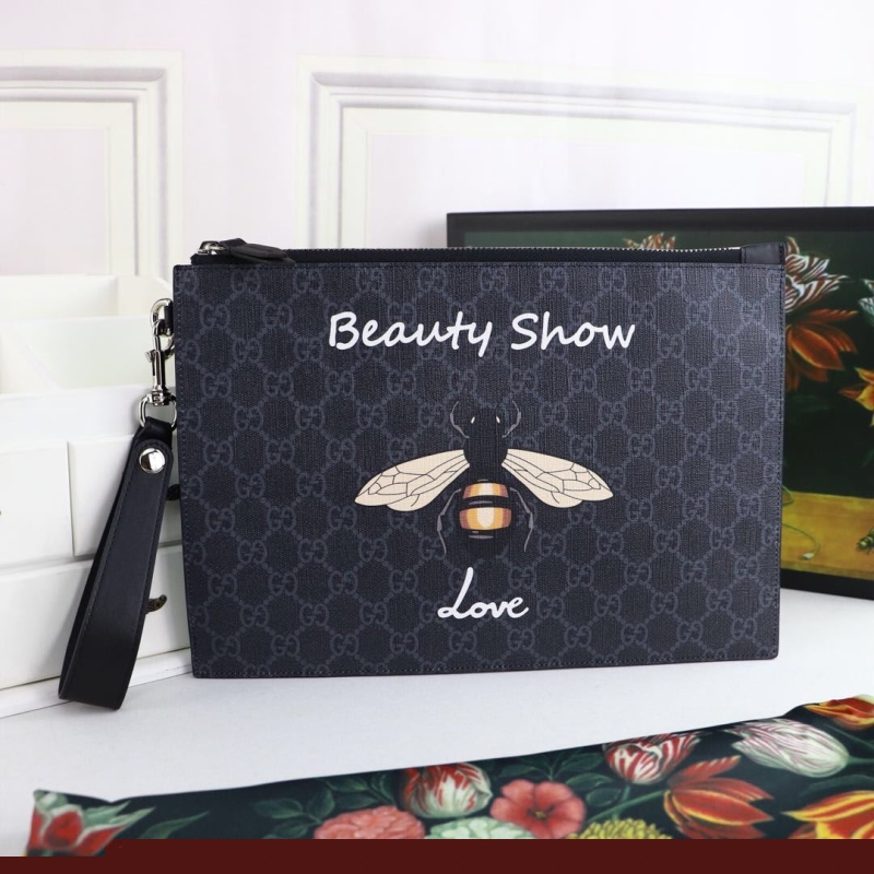 G*u*i clutch bags